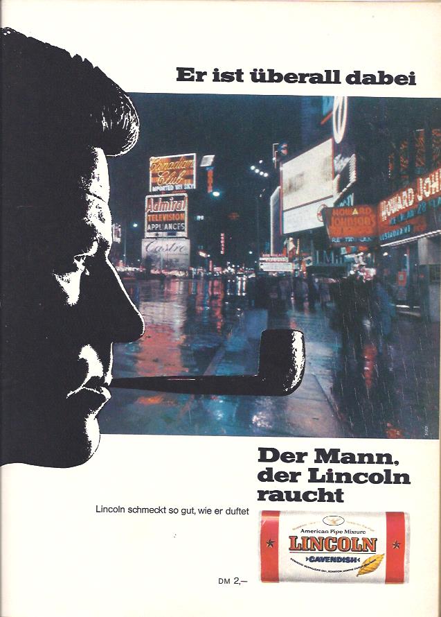 Der Mann, der Lincoln raucht, sei überall dabei - verspricht diese Anzeige für Lincoln Pfeifentabak aus dem Jahr 1967. Das Foto zeigt einen Sehnsuchtsort, den regennassen Times Square in New York. Der Regen ist vielleicht nicht unbedingt erstrebenswert, aber die Leuchtreklame wirkt so einfach besser, wenn sie sich auf der Straße spiegelt.